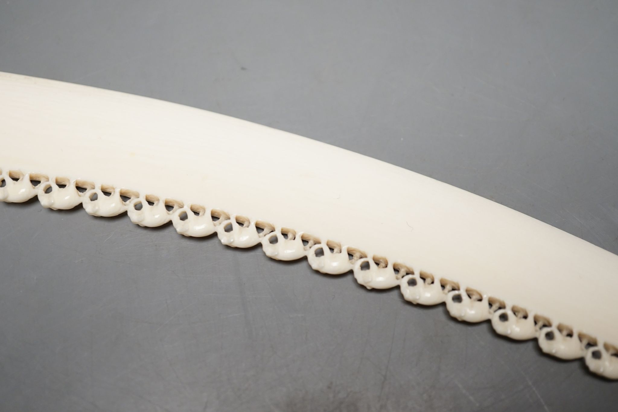 An Indian ivory letter opener, 38cm, and a Ganesh figure
